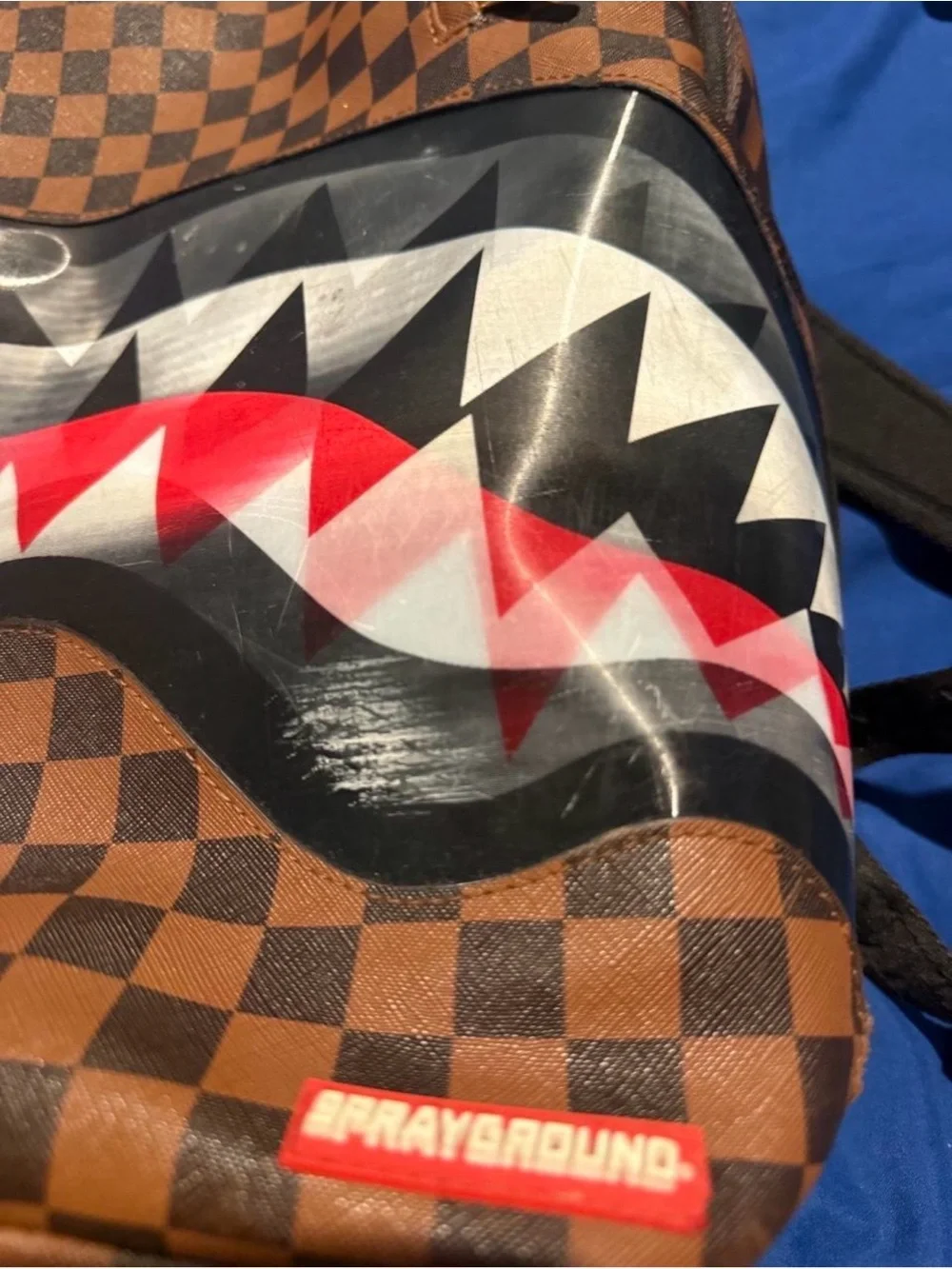 Sprayground Brown Checkered Shark Mouth Backpack with Red Accents